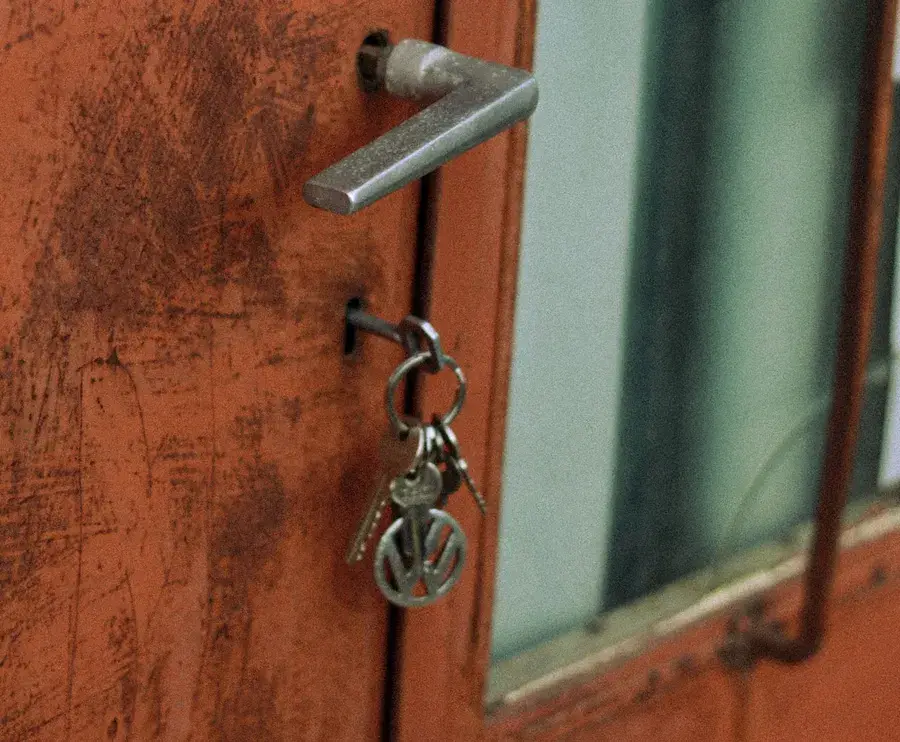 Keys hanging from the lock of an old door – why keys snap and when broken key removal Consett is needed, Locksmith Consett