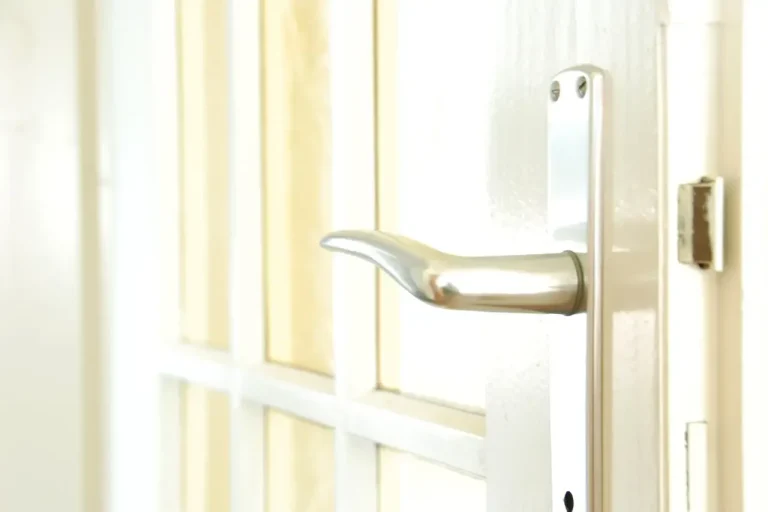 Lock repair or replacement in Consett – white door with a lever handle and locking plate, Locksmith Consett guide to which your door needs